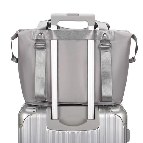 CJ gray convertible backpack handbag attached to suitcase handle for travel convenience