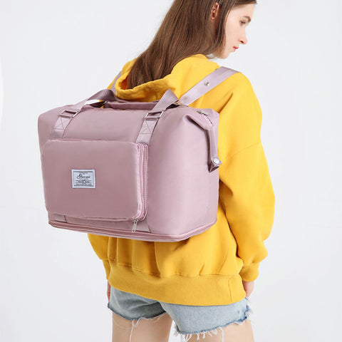 CJ pink convertible backpack handbag worn by woman in yellow sweatshirt and denim shorts