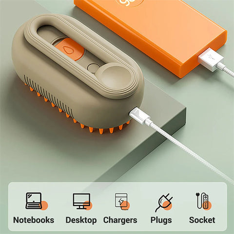 CJ electric pet grooming brush with ergonomic handle and orange silicone bristles connected to a charger