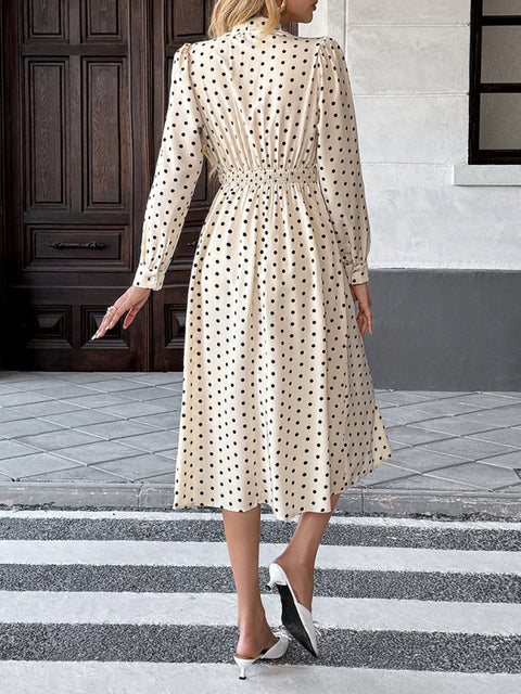 Elegant mid-length skirt with bow tie collar, long sleeves and waist polka dot dress