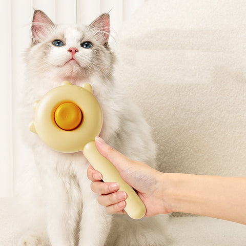 CJ pet hair removal brush being used on a fluffy white and gray cat with blue eyes