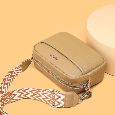 CJ beige rhombus embroidered crossbody bag with patterned adjustable strap and zipper closure