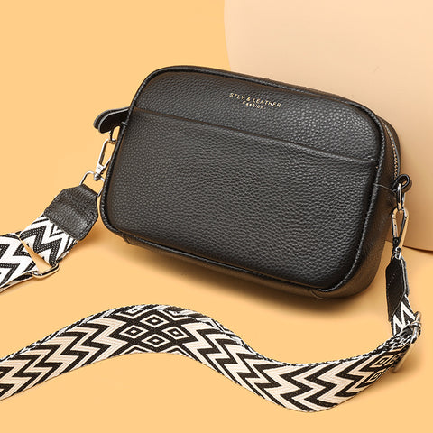 CJ rhombus embroidered crossbody bag in black leather with patterned adjustable strap