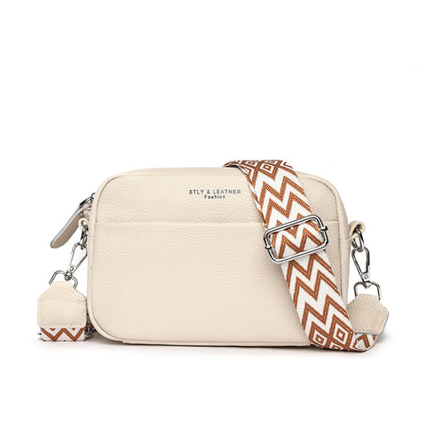 CJ rhombus embroidered crossbody bag in beige with brown and white patterned adjustable strap