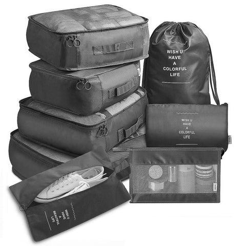 CJ 8-piece packing cube set in black with various sizes for organized travel storage