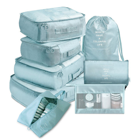 CJ 8-piece packing cube set in light blue with various sizes of zippered organizers for travel and storage